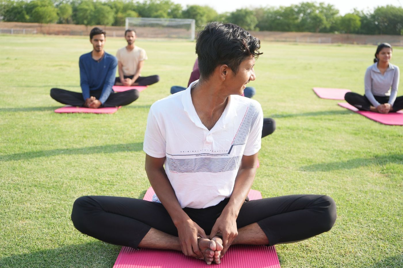 Navpratap in a seated pose turning to look over his shoulder